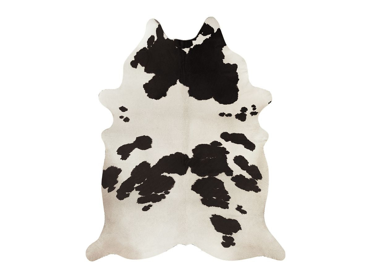PERLE vloerkleed met dierenhuideffect en koeienpatroon