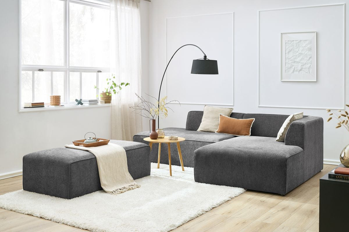 Canapé d'angle fixe modulable MEGEVE tissu texturé avec pouf