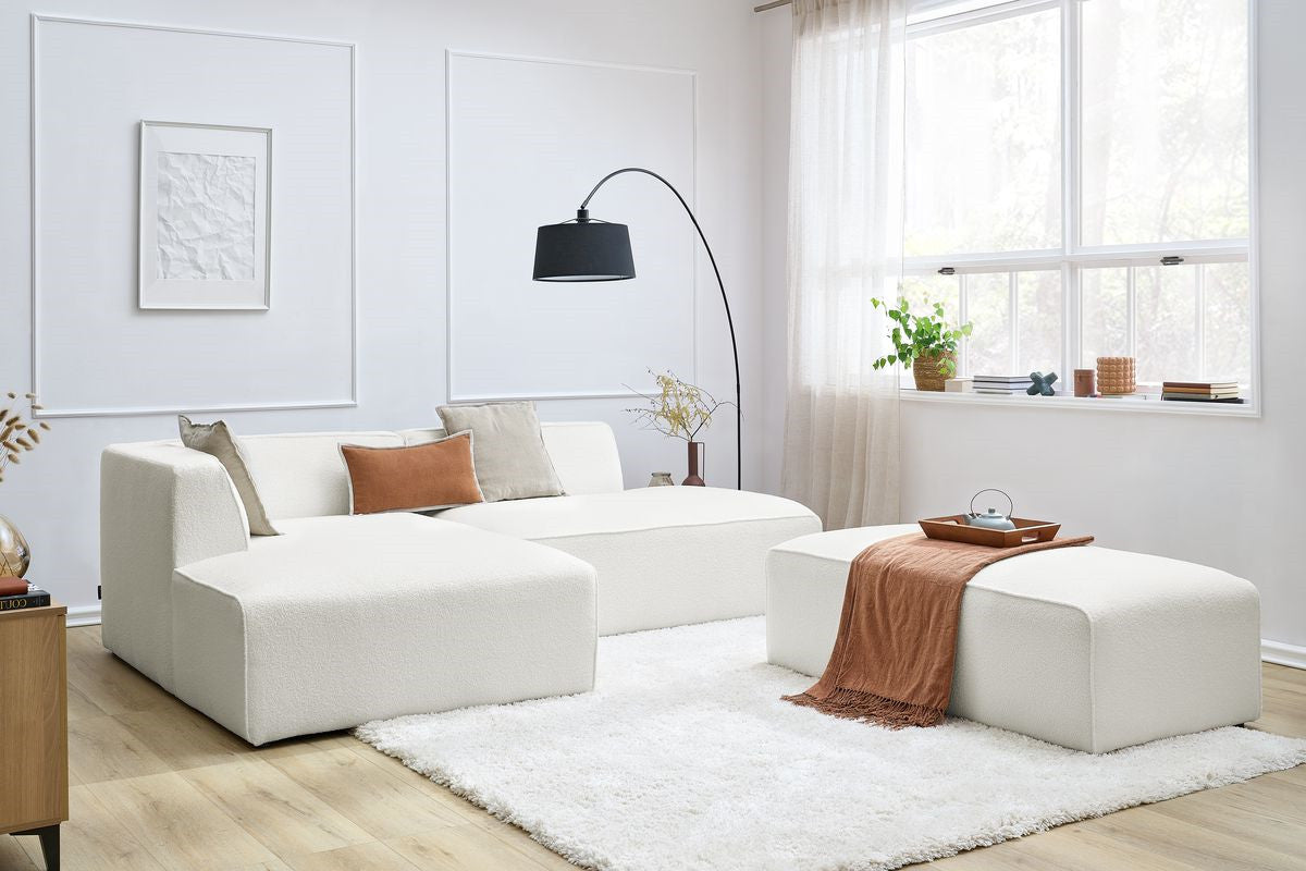 Canapé d'angle fixe modulable MEGEVE tissu bouclette avec pouf