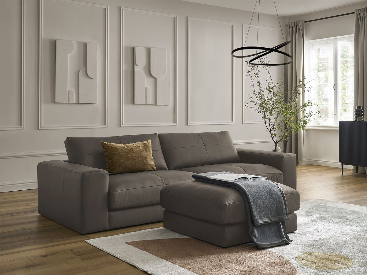 LEONARD vaste 3-zits rechte bank in koeienhuid met voetenbank